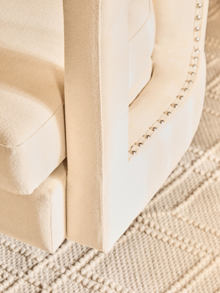 Hestia Beige Velvet Swivel Chair with Matte Black Base
