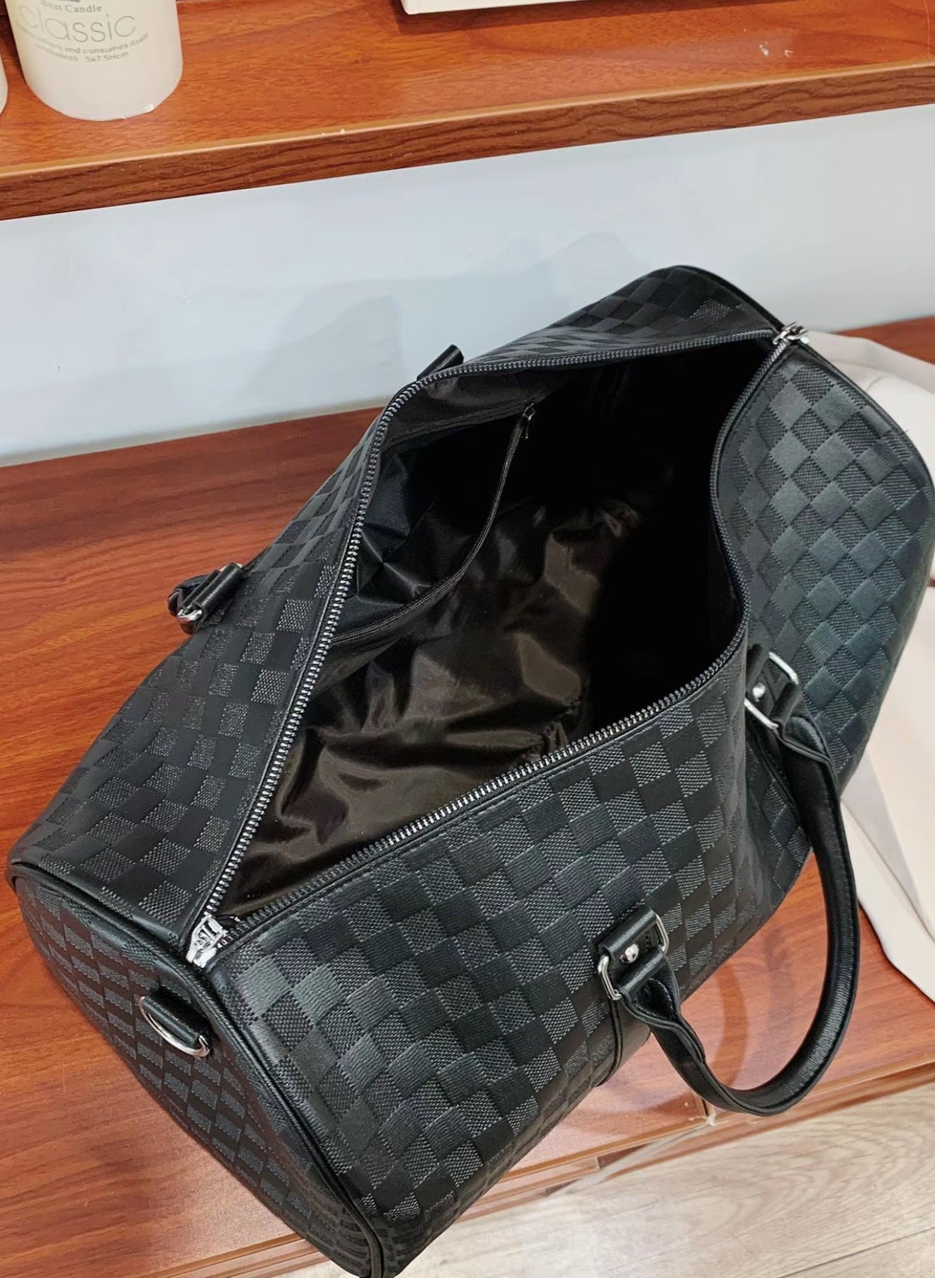 Luxury Black Checkered Duffel Bag with Shoulder Strap