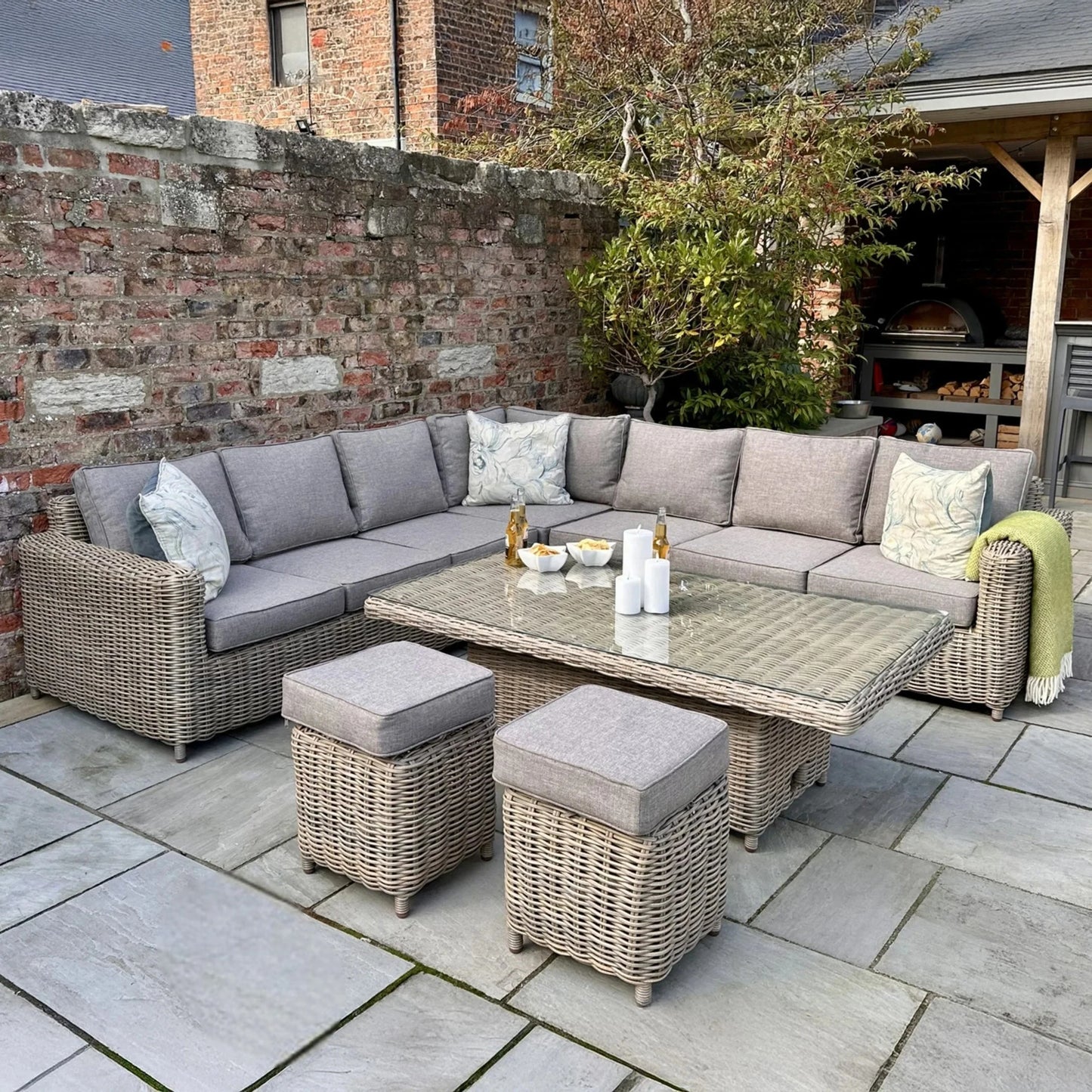 Luxury Amalfi Outdoor Modular Corner Sofa Set In Beige Wicker With Riser Dining Table And Stools
